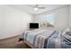 Cozy bedroom with a comfortable bed, neutral-colored walls, and a large window offering natural light at 1200 Country Club Dr # 2206, Largo, FL 33771