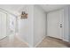 Hallway with tile flooring and a decorative wall hanging at 1200 Country Club Dr # 2206, Largo, FL 33771