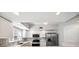 Bright kitchen features stainless steel appliances, stone countertops, and ample cabinet space at 1200 Country Club Dr # 2206, Largo, FL 33771