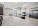 A bright, remodeled kitchen with marble countertops, stainless steel appliances, and ample counter space at 1200 Country Club Dr # 2206, Largo, FL 33771