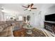The living room boasts a ceiling fan, plush sofa, and decorative elements at 1200 Country Club Dr # 2206, Largo, FL 33771