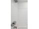 Bright and clean shower with classic white tile at 1200 Country Club Dr # 2206, Largo, FL 33771