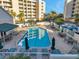 Relax by the community pool with ample lounge chairs and umbrellas for residents at 1200 Country Club Dr # 2206, Largo, FL 33771