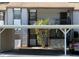 Condominium with tan exterior and carport parking at 12155 Environmental Dr # 6, New Port Richey, FL 34654