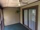 The screened patio offers a calm space to relax, complete with a ceiling fan and a view to the outside at 12155 Environmental Dr # 6, New Port Richey, FL 34654