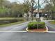 Neighborhood street with a pond and water feature fountain in the background at 12155 Environmental Dr # 6, New Port Richey, FL 34654
