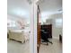 View of two bedrooms showcases decor, including a desk and floral wall art at 1216 Lotus Path, Clearwater, FL 33756