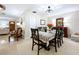 Inviting dining room with a beautifully set table, decorative accents, and seamless flow to living areas at 1216 Lotus Path, Clearwater, FL 33756