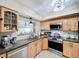Functional kitchen with stainless steel appliances, granite countertops, and ample cabinet space at 1216 Lotus Path, Clearwater, FL 33756