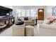 Bright living room featuring neutral-toned furniture and ample natural light at 1216 Lotus Path, Clearwater, FL 33756