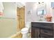 Bathroom includes a stand-up shower with a tile surround and a dark wood vanity at 12200 Vonn Rd # 6D, Largo, FL 33774