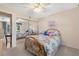 Bright bedroom features a mirrored closet, ceiling fan, and natural light at 12200 Vonn Rd # 6D, Largo, FL 33774