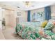 This bedroom features a sliding closet, a window and a dresser at 12200 Vonn Rd # 6D, Largo, FL 33774