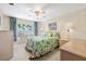 Comfortable bedroom with matching nightstands, lamps, and a window at 12200 Vonn Rd # 6D, Largo, FL 33774