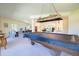 Large community center common room with pool table, treadmill, and ample seating at 12200 Vonn Rd # 6D, Largo, FL 33774