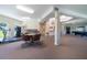 Spacious common room featuring a treadmill, pool table and seating area at 12200 Vonn Rd # 6D, Largo, FL 33774
