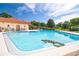 Sparkling community pool with a fun alligator float and inviting atmosphere at 12200 Vonn Rd # 6D, Largo, FL 33774