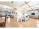 Open living area features wood floors, ceiling fan, and decorative built-in shelving at 12200 Vonn Rd # 6D, Largo, FL 33774