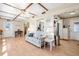 Cozy living room with comfortable furniture, ceiling fan, and easy kitchen access at 12200 Vonn Rd # 6D, Largo, FL 33774