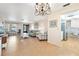 Inviting living room with bright chandelier and lots of natural light at 12200 Vonn Rd # 6D, Largo, FL 33774