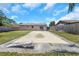 Backyard view featuring a partially covered pool area, fencing, and green space at 12704 128Th Ln, Largo, FL 33774