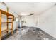 Spacious garage with concrete floor, wooden shelves, and utility connections at 12704 128Th Ln, Largo, FL 33774