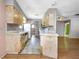 Functional kitchen area with light-colored cabinets and tile flooring at 12704 128Th Ln, Largo, FL 33774