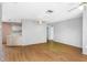 Open-concept living area with hardwood flooring and ceiling fans at 12704 128Th Ln, Largo, FL 33774