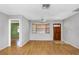 Spacious living room with hardwood floors, natural light, and a view into another room at 12704 128Th Ln, Largo, FL 33774