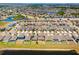 Wide aerial view of a Primary-planned community with modern homes, serene ponds, and green spaces enhancing community appeal at 14618 Scottburgh Glen Dr, Wimauma, FL 33598