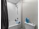 Bathroom shower with tiled walls and decor at 14618 Scottburgh Glen Dr, Wimauma, FL 33598