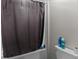 Clean bathroom with a bathtub and shower, complemented by sleek fixtures and ample space at 14618 Scottburgh Glen Dr, Wimauma, FL 33598