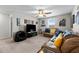Large bonus room with a ceiling fan, comfortable seating, and decor at 14618 Scottburgh Glen Dr, Wimauma, FL 33598