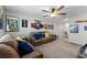Spacious bonus room with ample seating and wall decorations at 14618 Scottburgh Glen Dr, Wimauma, FL 33598