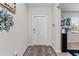 Welcoming entryway with neutral walls, decorative accents, and a patterned rug at 14618 Scottburgh Glen Dr, Wimauma, FL 33598