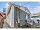 Charming gray brick house featuring a classic white-trimmed accent and a well-maintained yard at 1510 E 18Th Ave, Tampa, FL 33605