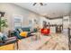 Open-concept living room featuring wood floors, natural light, and an adjacent modern kitchen at 1510 E 18Th Ave, Tampa, FL 33605