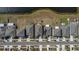 An aerial view of a block of single Gathering homes with grass yards, driveways, and street parking at 15613 Charr Island St, Sun City Center, FL 33573