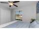 Inviting bedroom with a cozy bed, a bright window, and a closet, creating a comfortable space at 15613 Charr Island St, Sun City Center, FL 33573