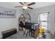 bedroom featuring a loft bed, a ceiling fan, and a gray and neutral color scheme at 15613 Charr Island St, Sun City Center, FL 33573