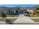 Charming single-story home with a well-maintained front yard and a two-car garage at 15613 Charr Island St, Sun City Center, FL 33573