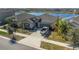 A charming single Gathering home has a well manicured yard and covered front entrance at 15613 Charr Island St, Sun City Center, FL 33573