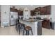 Beautiful kitchen with granite counters, stainless steel appliances, and convenient seating at the island at 15613 Charr Island St, Sun City Center, FL 33573