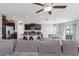 Open-concept living area showcasing modern kitchen, dining space, and cozy seating, ideal for gatherings at 15613 Charr Island St, Sun City Center, FL 33573