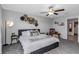 Cozy main bedroom with decorative wall art and warm, inviting lighting at 15613 Charr Island St, Sun City Center, FL 33573