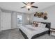Comfortable main bedroom with a plush bed, stylish wall decor, and soft lighting at 15613 Charr Island St, Sun City Center, FL 33573