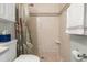 Full bathroom showcases a shower with neutral colored tiles, shower curtain and updated fixtures at 2087 Hunters Glen Dr # 126, Dunedin, FL 34698