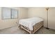 Bedroom with neutral tones, a large window for natural light, and plush carpeting at 2087 Hunters Glen Dr # 126, Dunedin, FL 34698