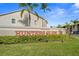 Hunters Glen community entrance with manicured landscaping and iconic signage, showcasing a welcoming and well-maintained neighborhood at 2087 Hunters Glen Dr # 126, Dunedin, FL 34698