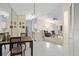 Open concept living area with tile flooring, adjacent to kitchen and has sliding glass doors at 2087 Hunters Glen Dr # 126, Dunedin, FL 34698